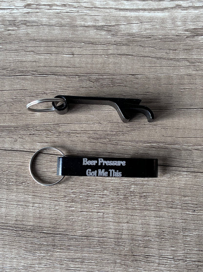 Bottle opener and keychain with text on a wooden surface