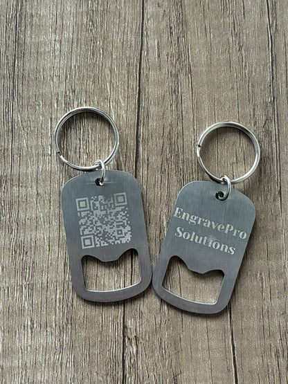 Two metal bottle opener keychains on a wooden surface with 'EngravePro Solutions' branding.