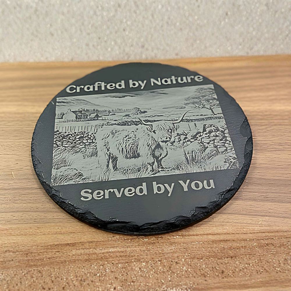 Engraved slate cheese and charcuterie board with rustic countryside artwork