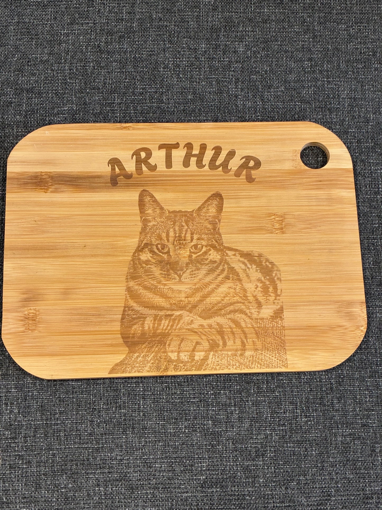 Engraved wooden board displaying a single cat illustration with custom personalisation