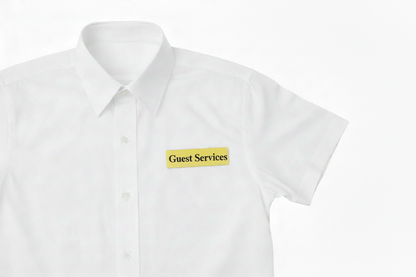 Engraved Pin Badge, Gold Coated with the name Guest Services