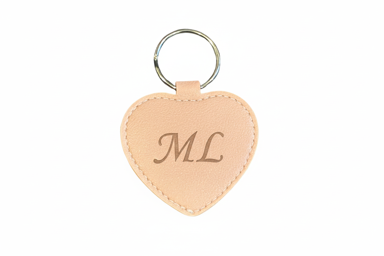 Heart-shaped keychain personalised with initials on a white background
