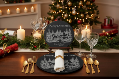 Christmas-themed table setting with decorative plates, glasses, and candles.