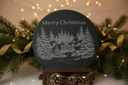 Slate board on display at Christmas with the words Merry Christmas engraved 
