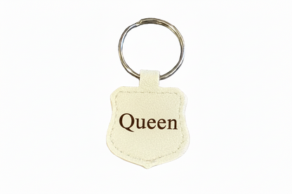 Keychain with 'Queen' text on a white background