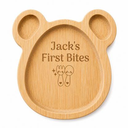 Wooden baby plate shaped like a bear with 'Jack's First Bites' engraving on a white background