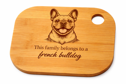 Wooden cutting board with a French Bulldog illustration and text on a white background