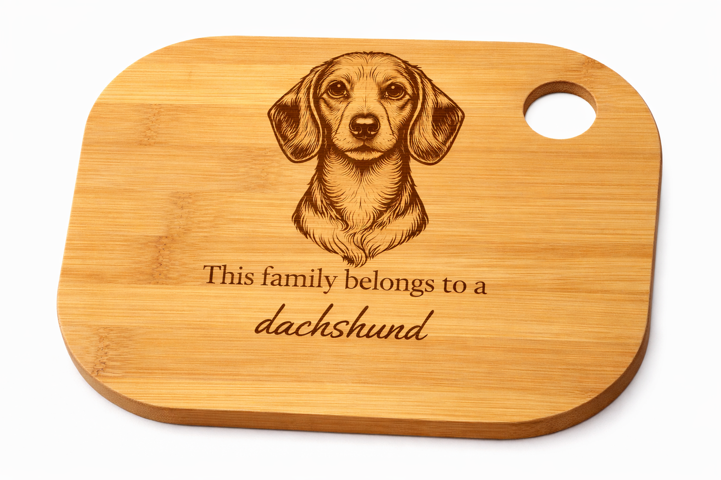 Wooden cutting board with a dachshund engraving and text on a white background