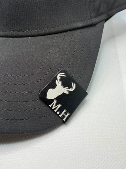 Personalised engraved metal cap clip fitted to a pink cap