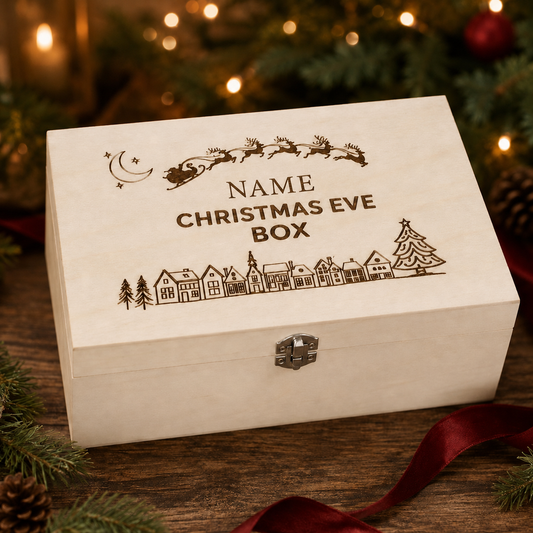 A personalised wooden Christmas Eve gift box with laser-engraved holiday illustrations and the text 'NAME CHRISTMAS EVE BOX', displayed on a wooden surface with festive lights and greenery in the background.