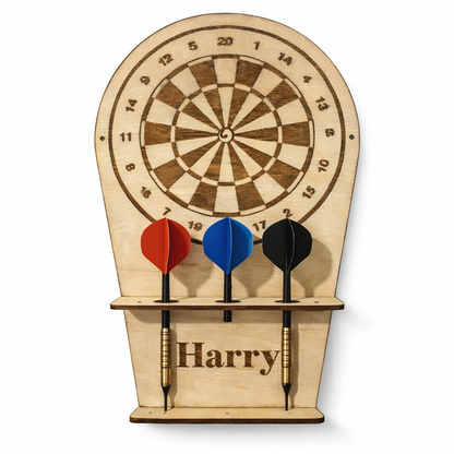 Wooden dartboard with three darts and 'Harry' engraved on a white background