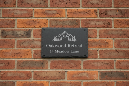 Personalised Slate Airbnb rental home-sign with logo and address on brick wall