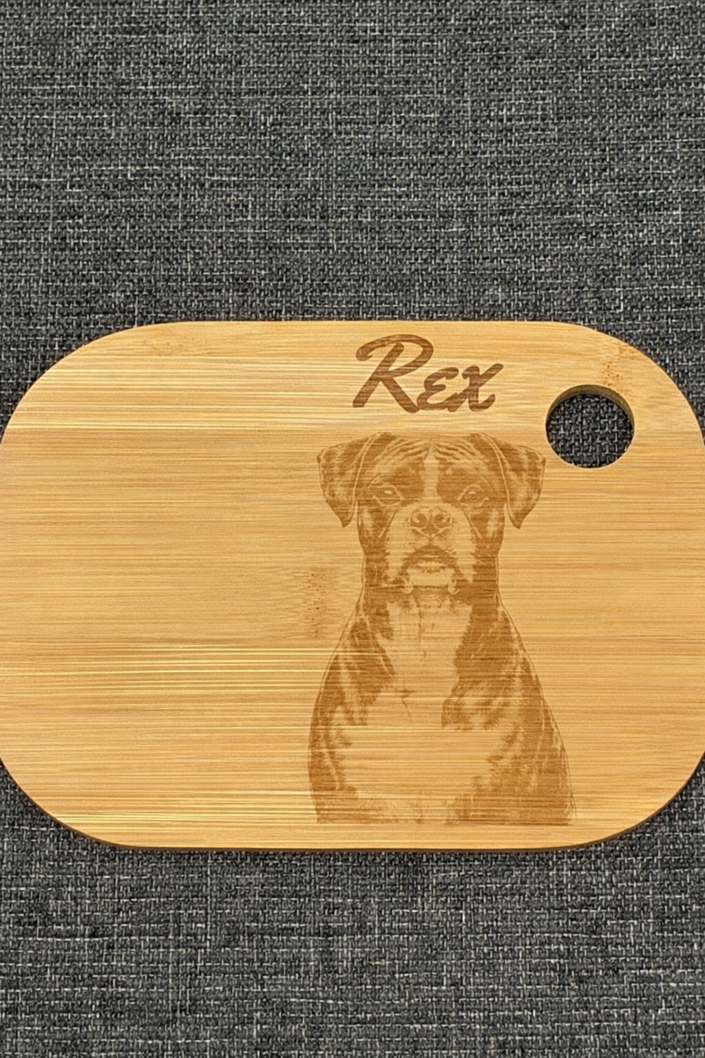 pet dog engraved onto a wooden chopping board with the name above