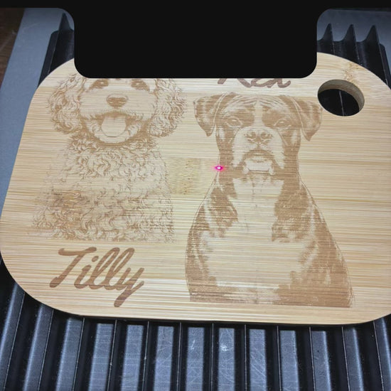 personalised pet photo of 2 dogs being engraved onto a wooden chopping board