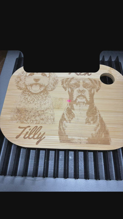 personalised pet photo of 2 dogs being engraved onto a wooden chopping board