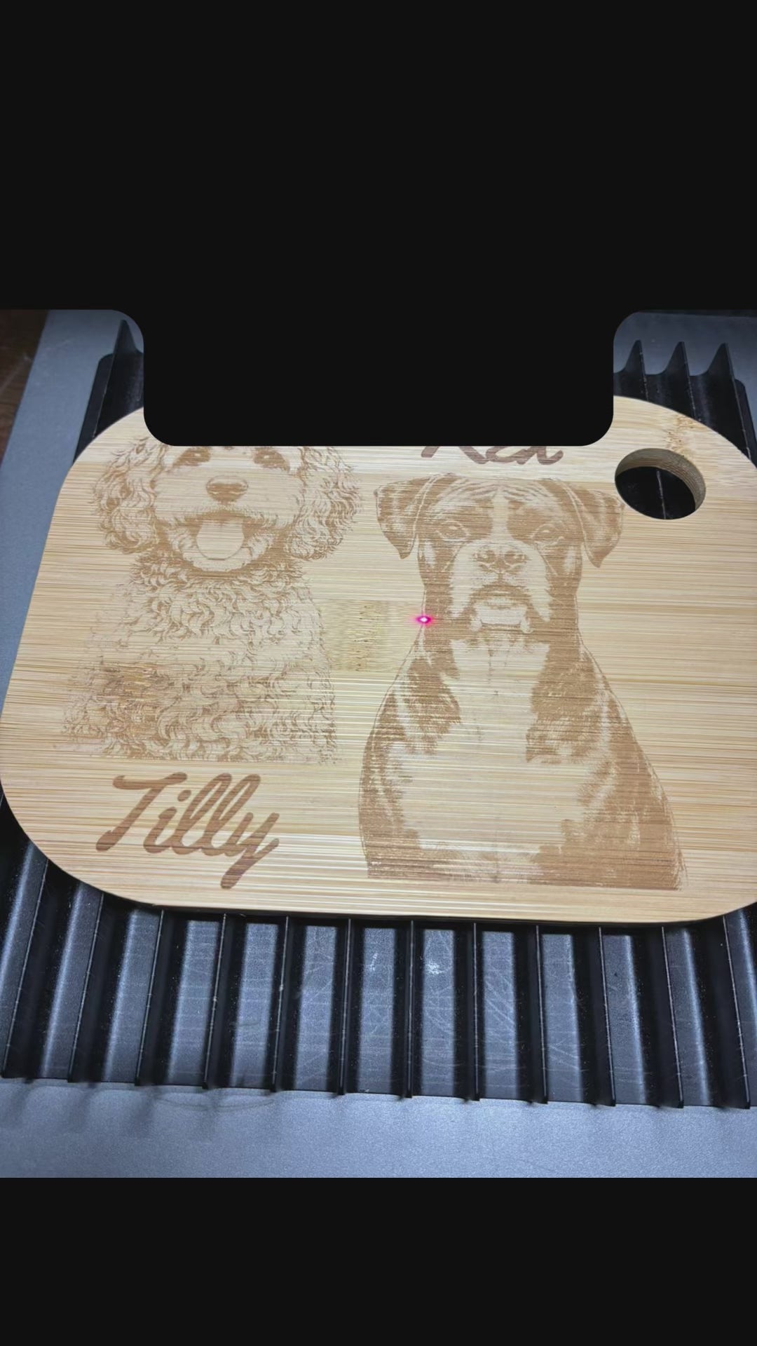 personalised pet photo of 2 dogs being engraved onto a wooden chopping board